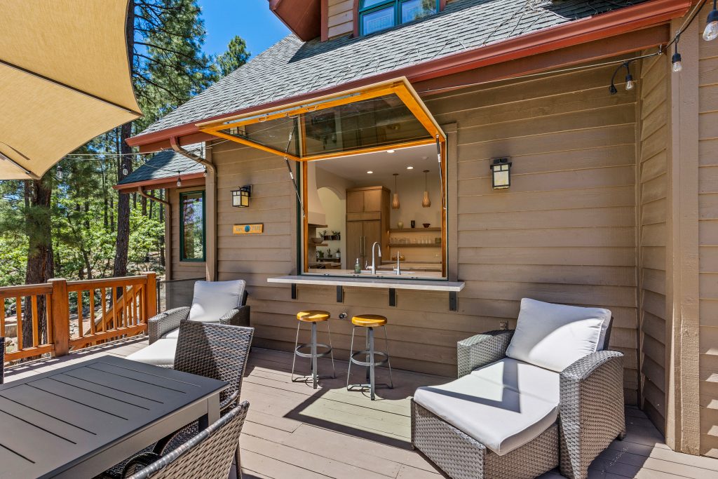 Home Remodel with Exterior Servery Window towards Kitchen