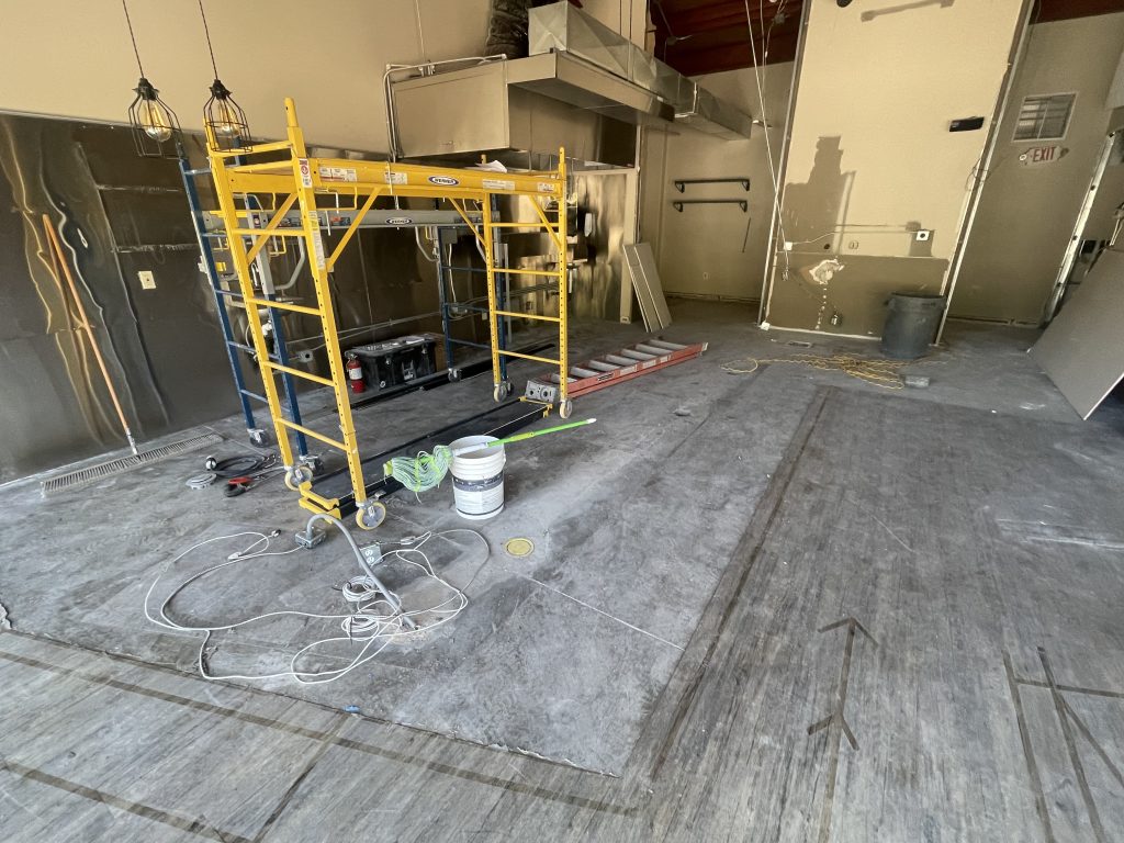 Flooring demo main food prep area General Contractor shows Tenant Improvement Demo stage